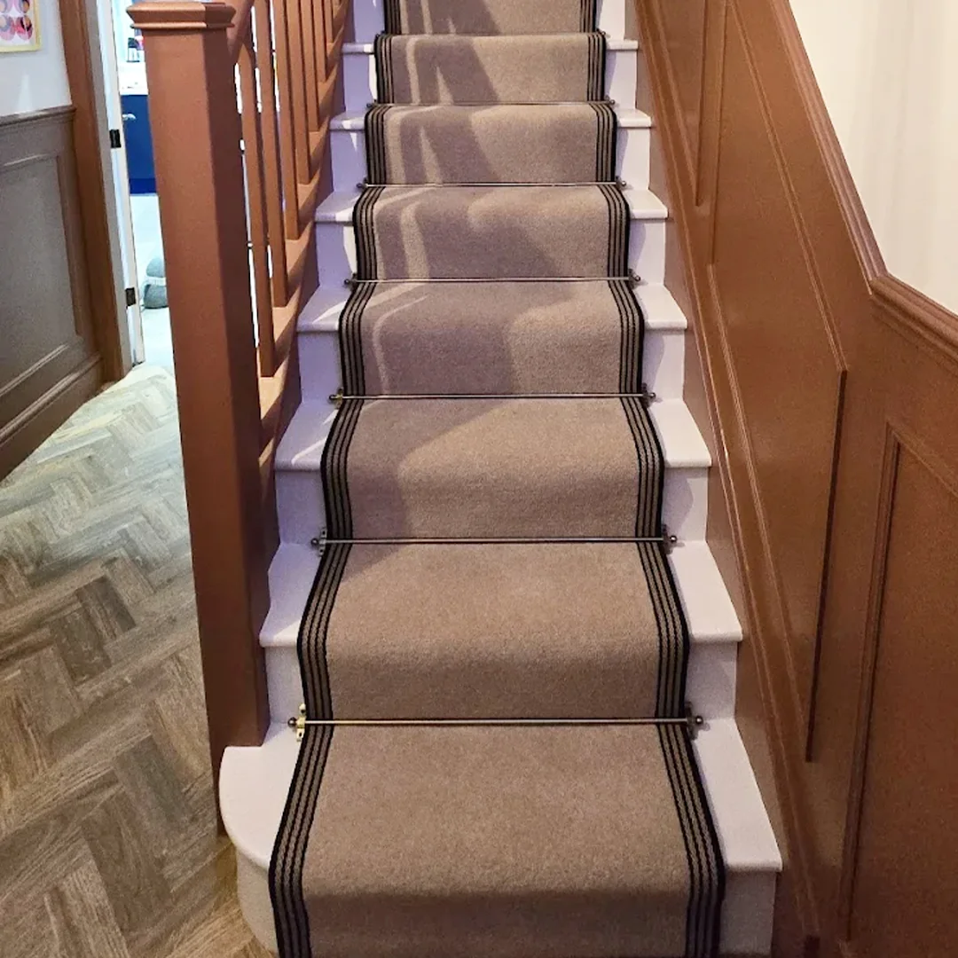 Stair runner finished with striped edge binding